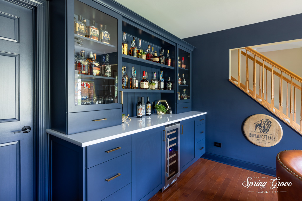 Nightfall colored cabinets with honey bronze hardware.