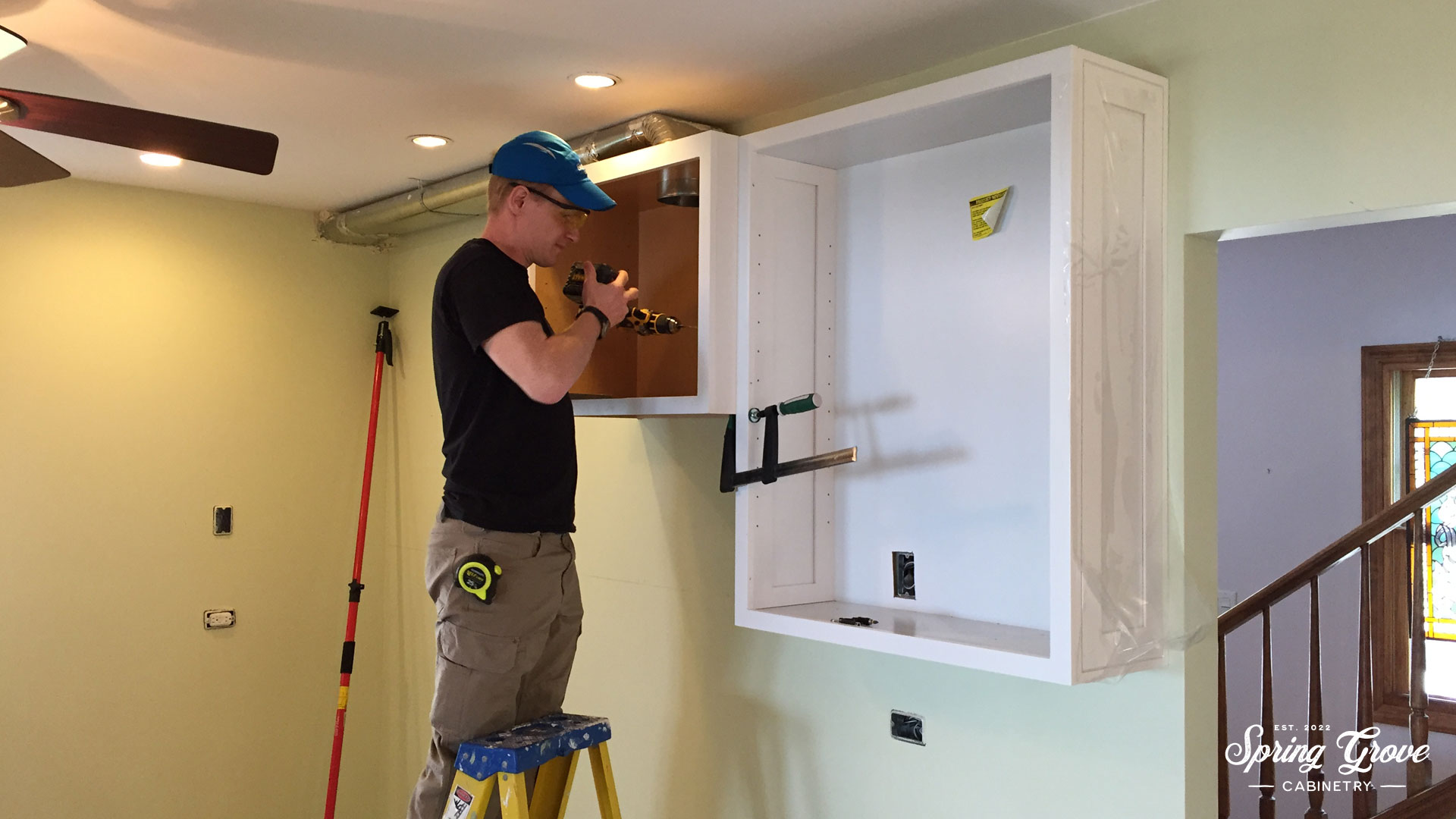 Chaten installing the modified cabinet.