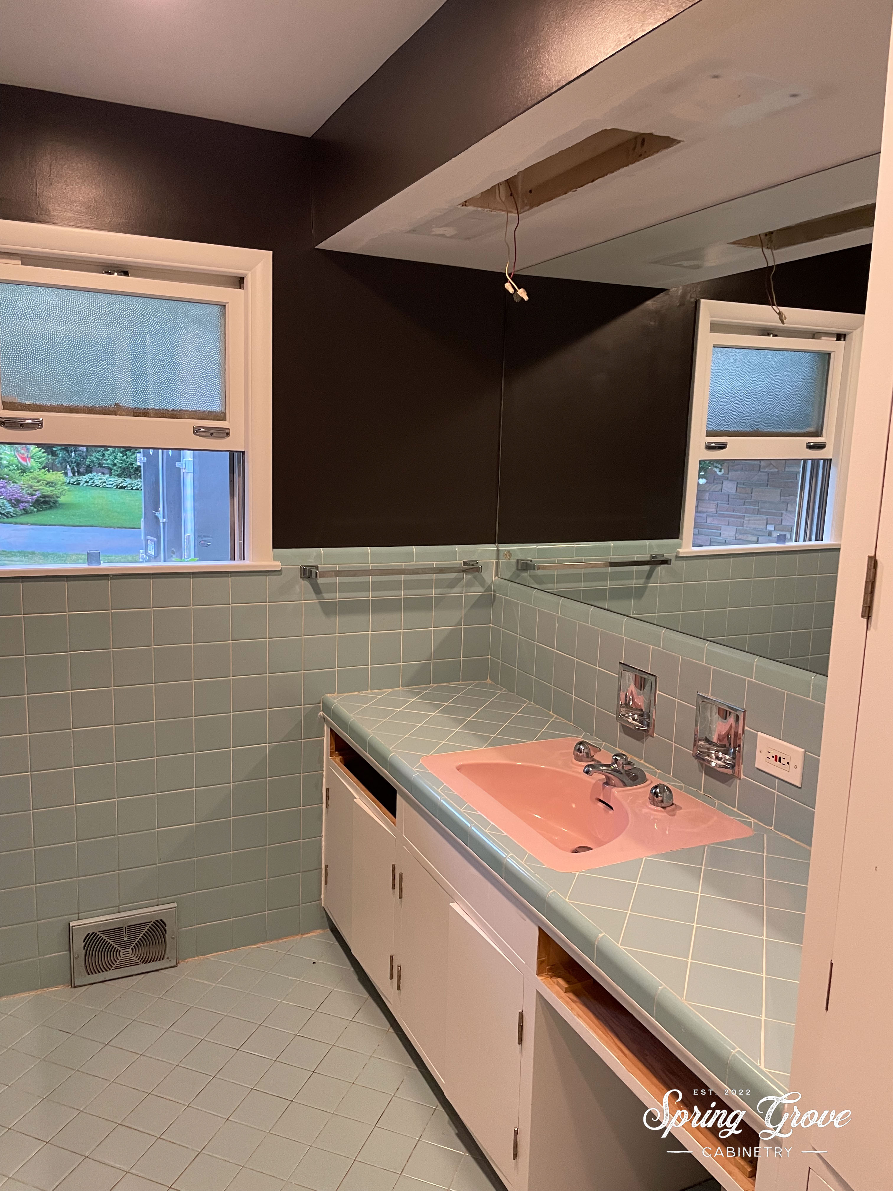 BEFORE: Pink sink and teal tile.