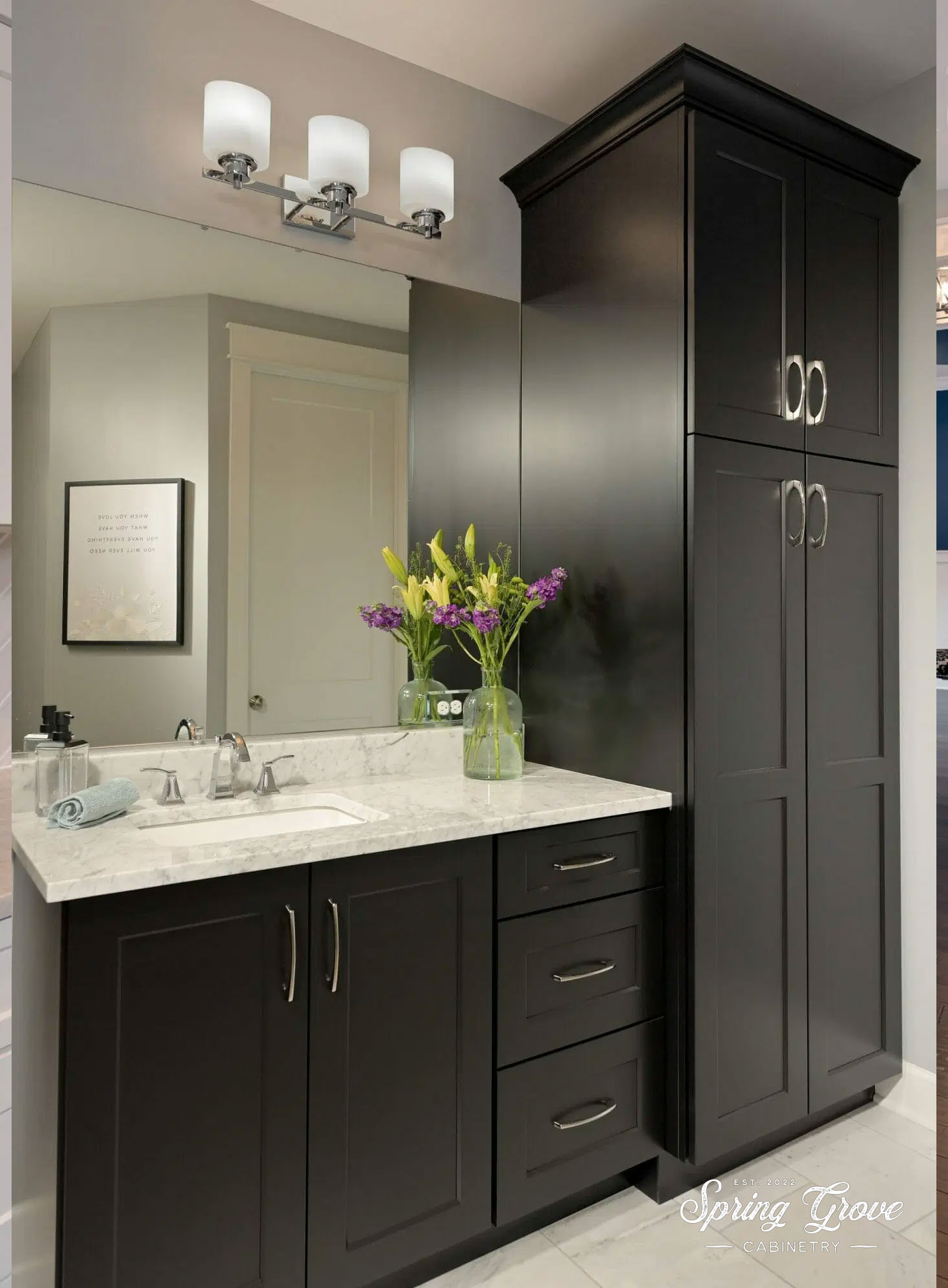 Primary bath vanity and linen cabient.