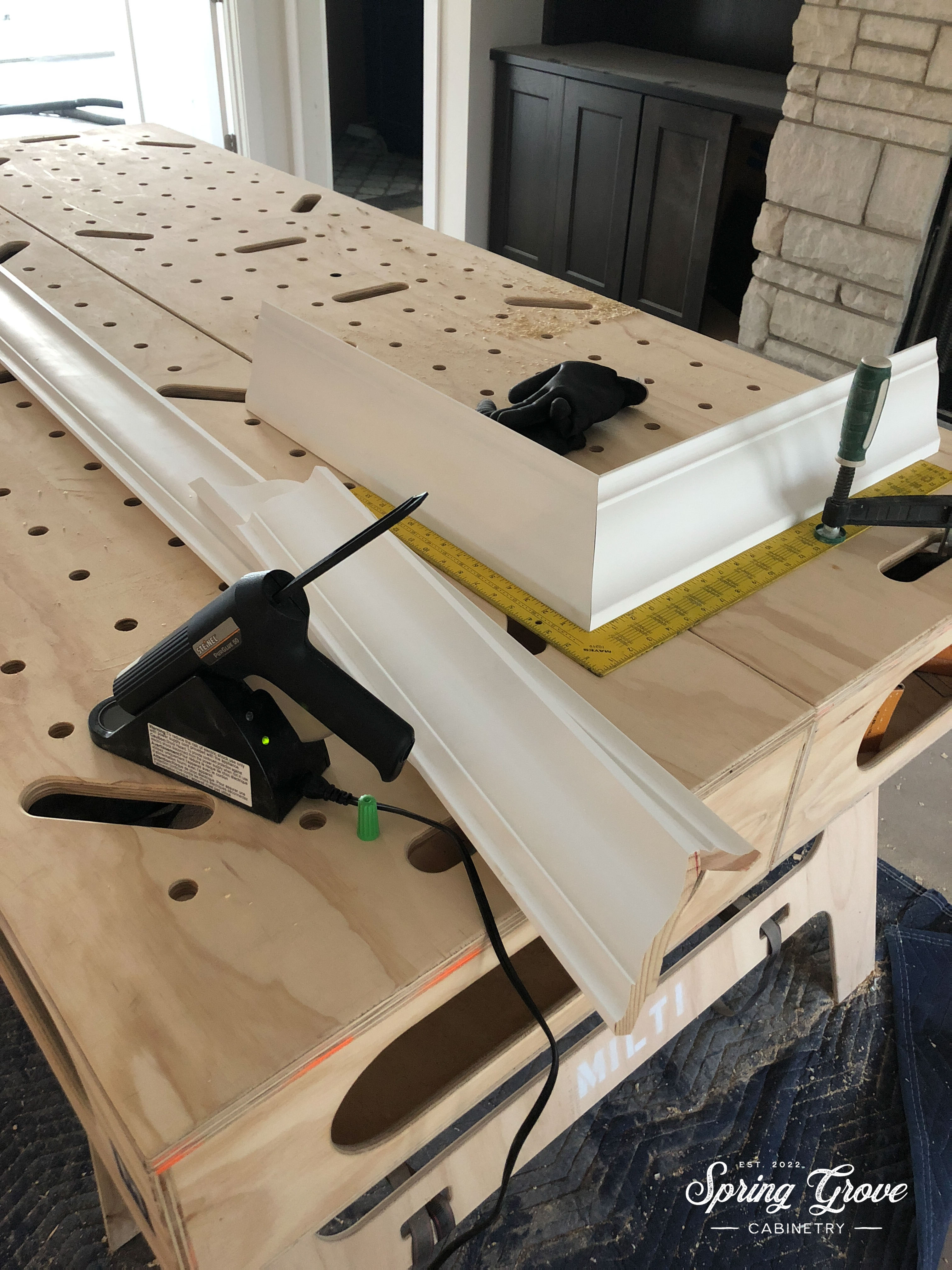 Gluing up the crown moulding to reduce visible nail holes.