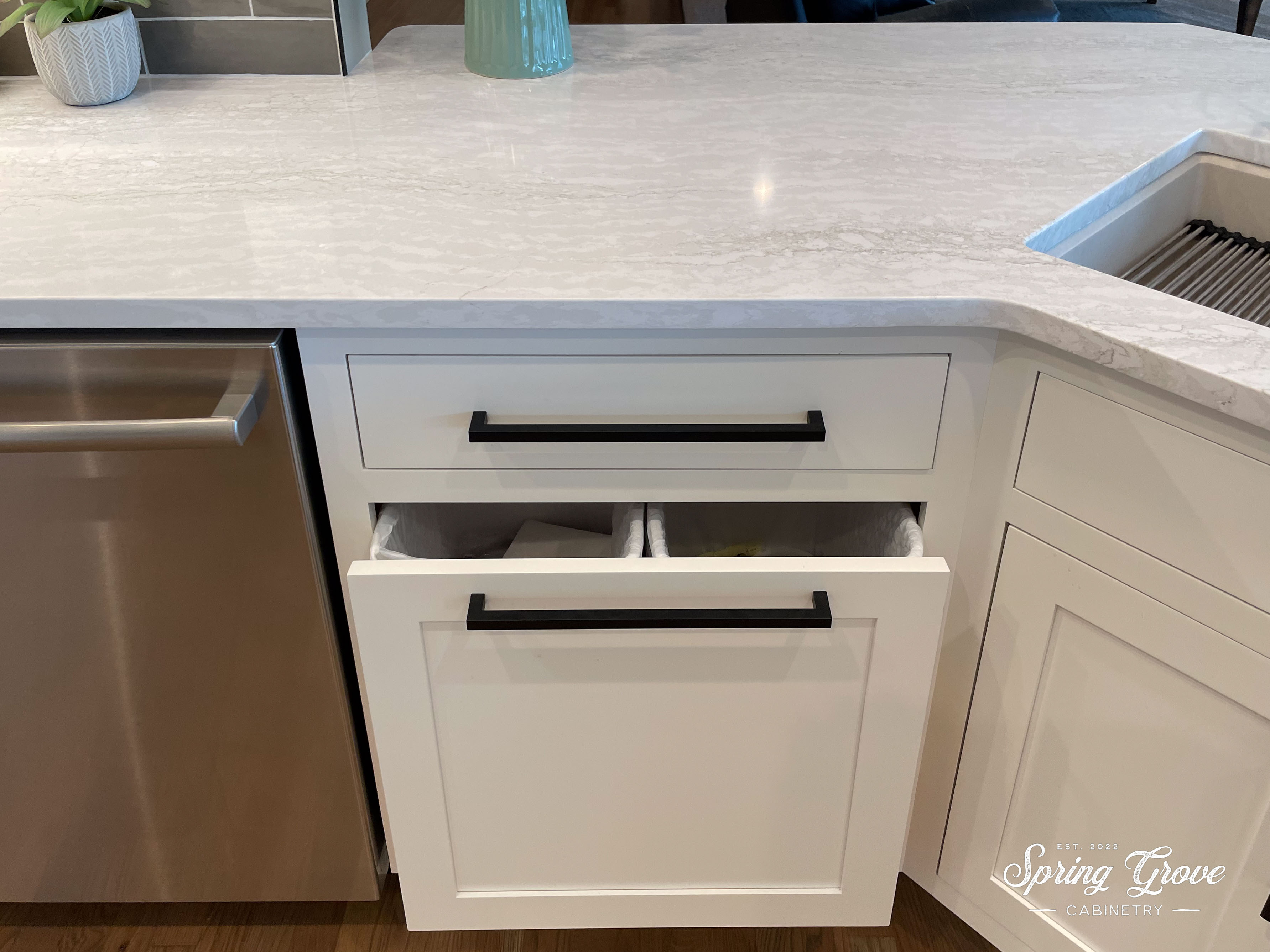 Trash and recycling drawer.