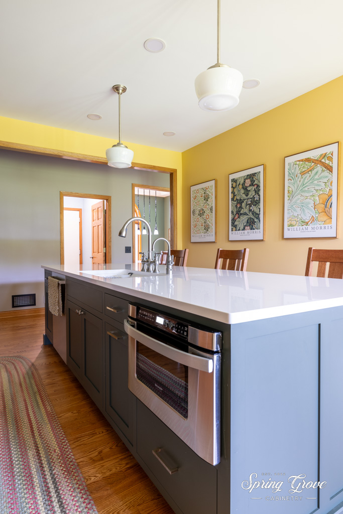 The evergreen island sits at 10 feet long with storage on both sides and inset drawer microwave for easy access use.