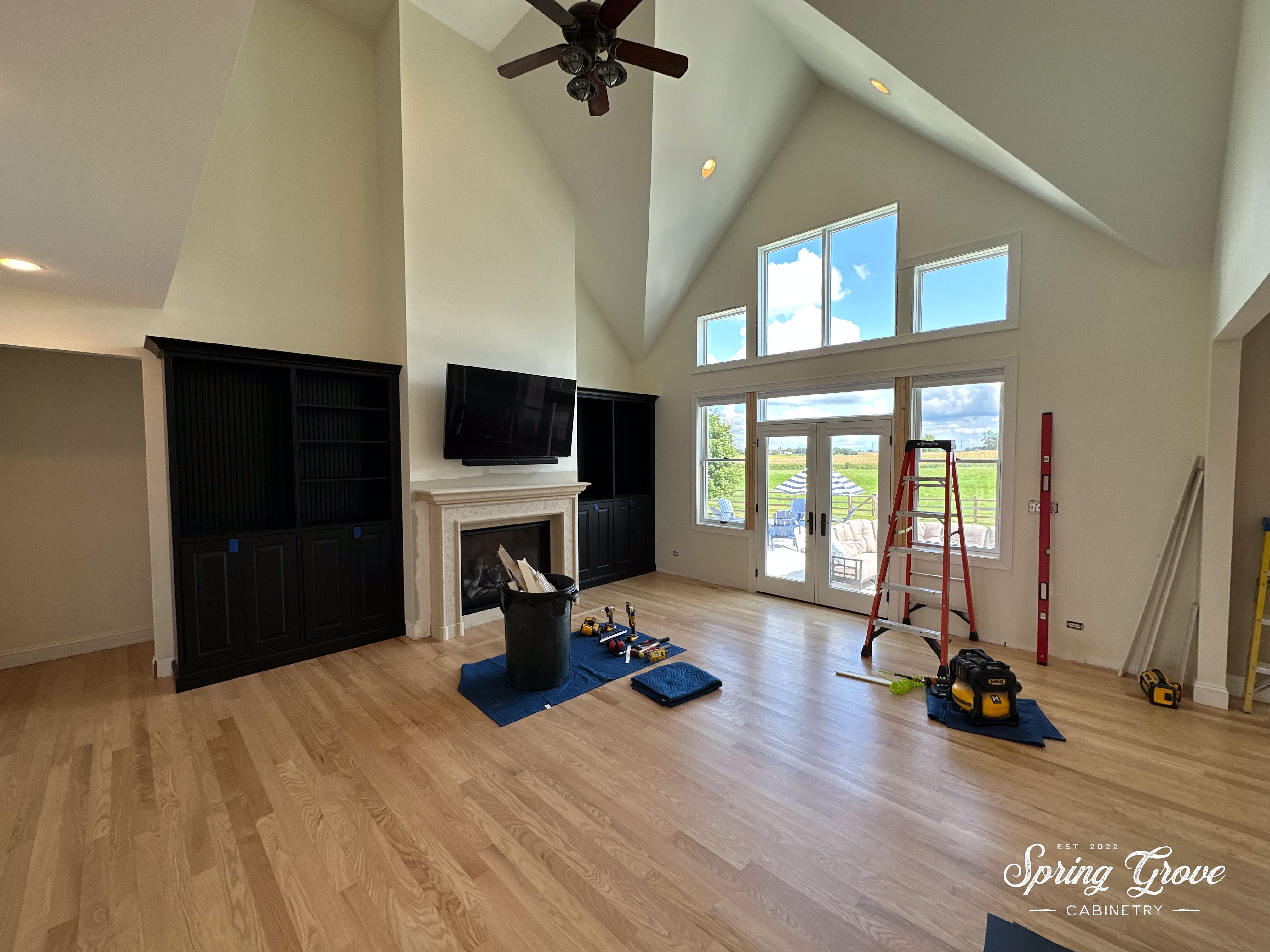 Installation of the cabinetry and window trim.