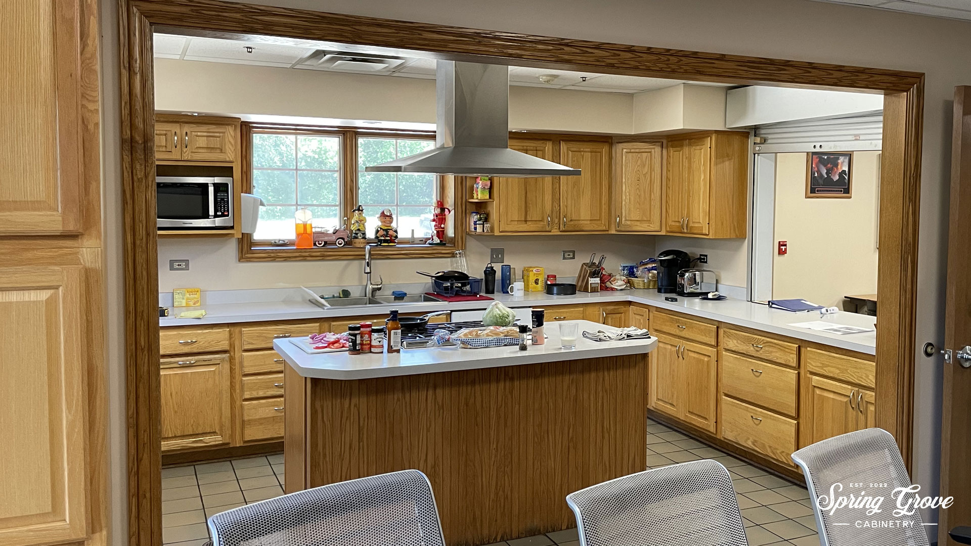 Before kitchen with a partition and a roll-up window.