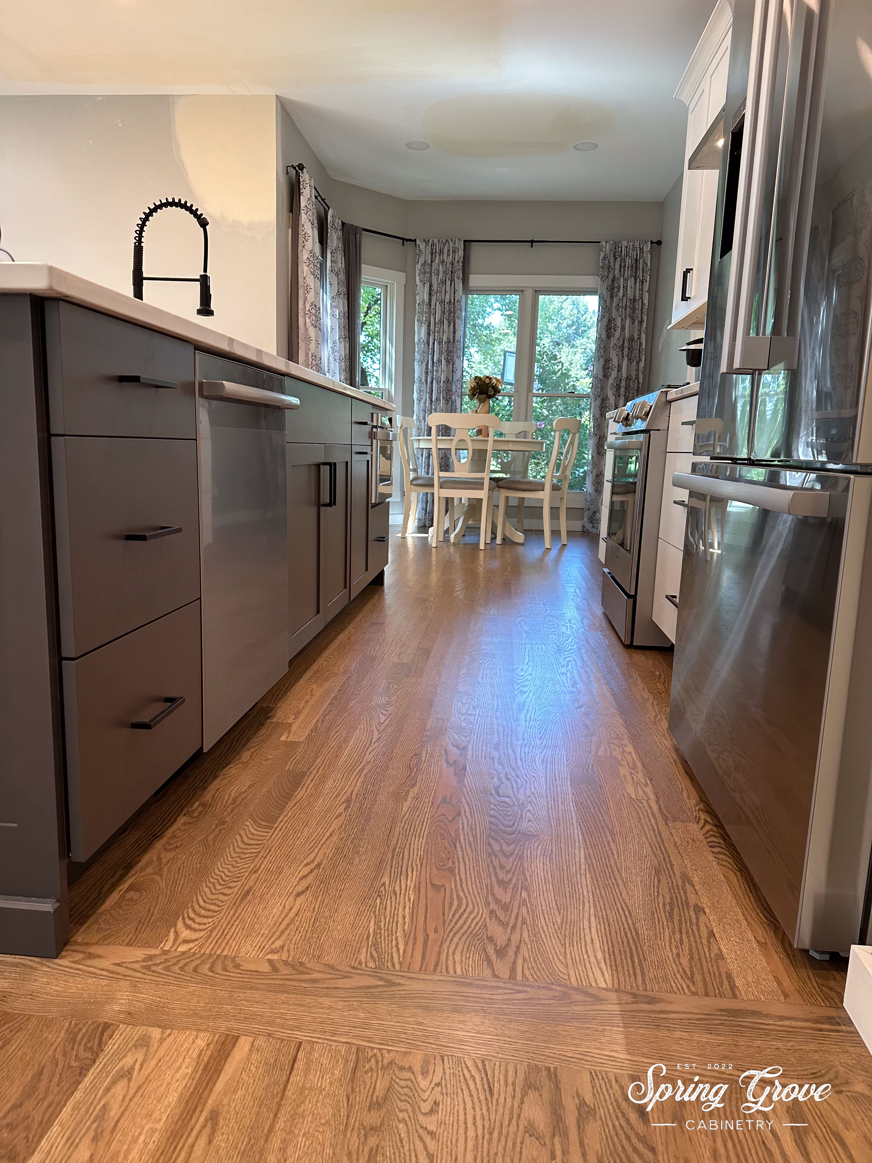 Island with a dishwasher, garbage, and microwave.