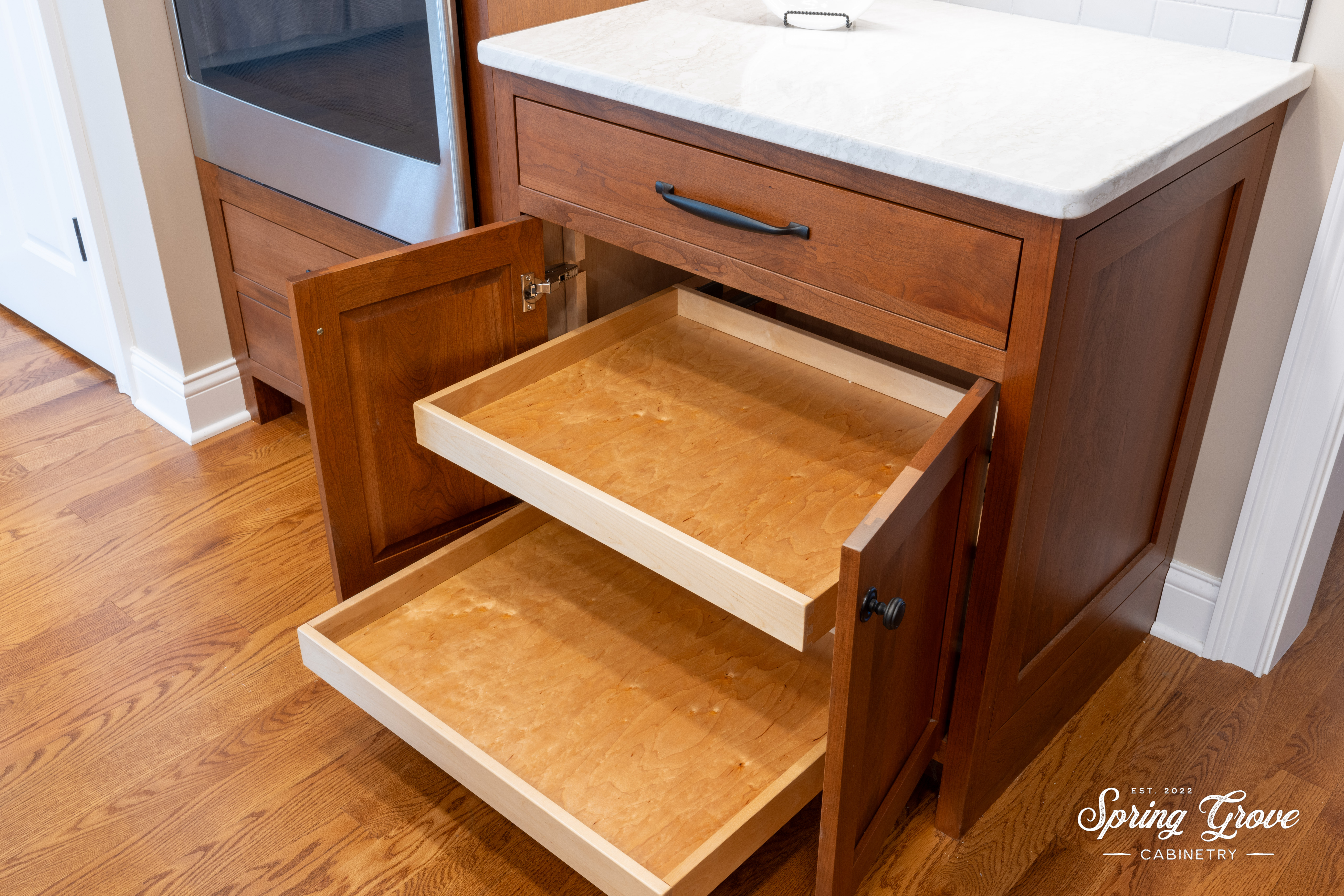 A few of the base cabinets feature adjustable roll-out trays.